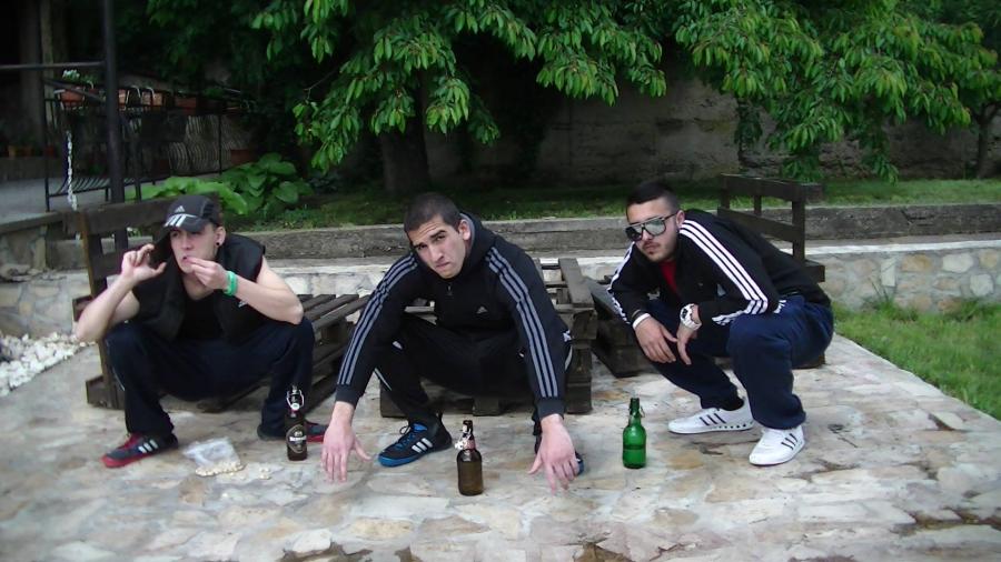 Squatting Slavs In Tracksuits
